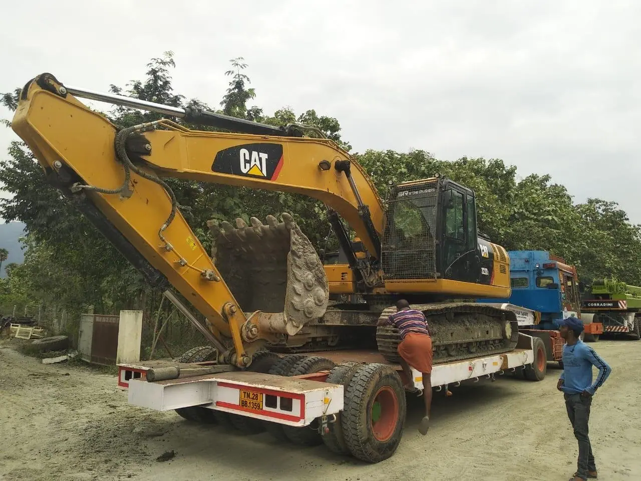 Excavator loaded on a low-bed trailer