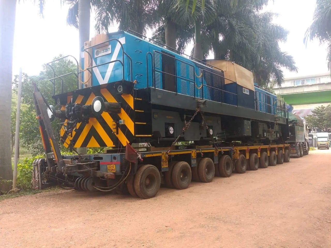 Locomotive carried on a multi-axle hydraulic trailer